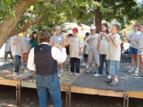 John Muir and kids do a group exercise